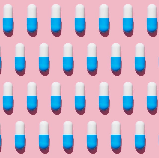 Repeated pills on pink background repeated pills on pink background