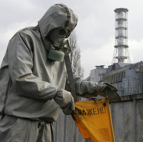 A rescue worker sets flag signalling rad