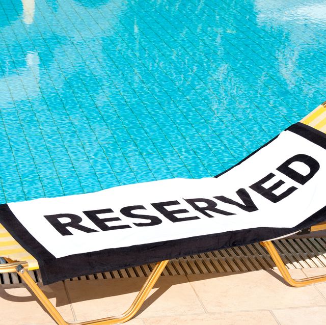 'Reserved' beach towel on a sun lounger