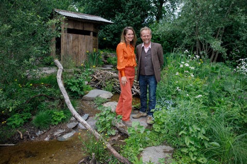 best show garden designers lulu urquhart and adam hunt pose in their 'rewilding great britain landscape' garden at the rhs chelsea flower show 2022, tuesday may 24, 2022 rhs  luke macgregor