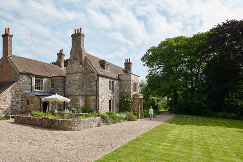 the sussex sandstone farmhouse dates to the 17th century, with porches and casement windows added around 1805