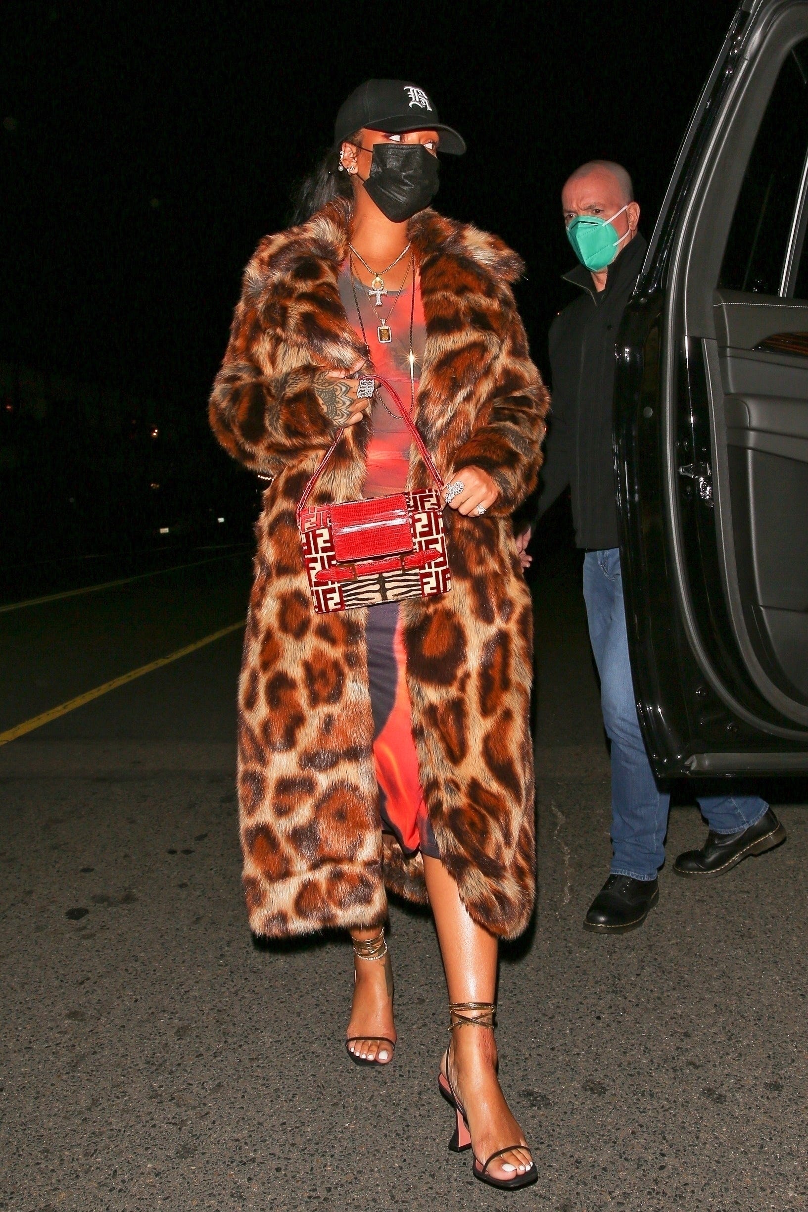 Rihanna Went Out to Dinner in a Leopard Coat, Red Midi Dress, Fendi Bag, and Baseball Cap