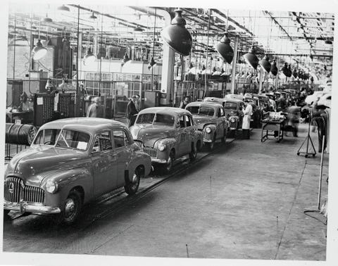 ROA090120_055 the first all australian motor, the "holden," is in mass production at the rate of 20,000 a year by general motors holdens ltd here are holden sedans coming off the production line at fishermen's bend plant production is undertaken at both fishermen's bend victoria and woodville south australia location fishermen's bend, victoria, australia