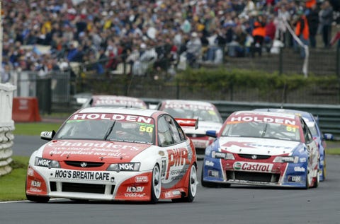 ROA090120_056 auckland, new zealand may 2 holden driver jason bright 50 heads off greg murphy 51 r at turn 1 on his way to winning race three in the v8 supercar round 3 at pukekohe park raceway on may 2, 2004 near auckland, new zealand bright headed off greg murphy 3rd and marcus ambrose 2nd to win the 3 race series photo by nigel marplegetty images