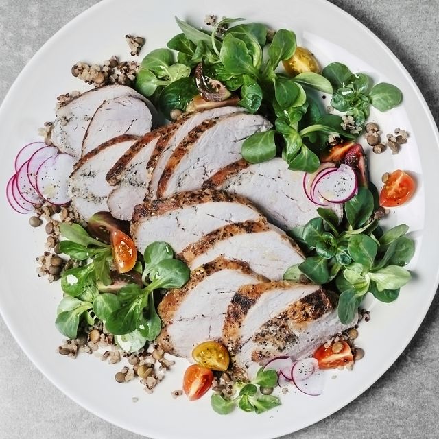 roasted pork with lentils and fresh salad