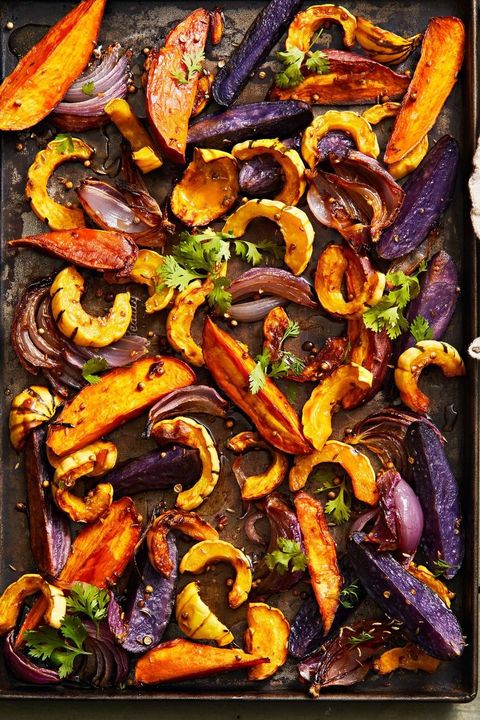 roasted squash, onion, sweet potato and purple potato on a sheet pan
