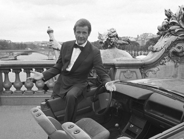 british actor roger moore on set of the james bond movie 'a view to a kill' with half a car during filming in paris, france in august 1984 photo by larry ellisexpressgetty images