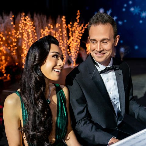 aimee garcia as angelina and freddie prinze jr as miguel in a scene from christmas with you, a good housekeeping pick for best romantic christmas movies