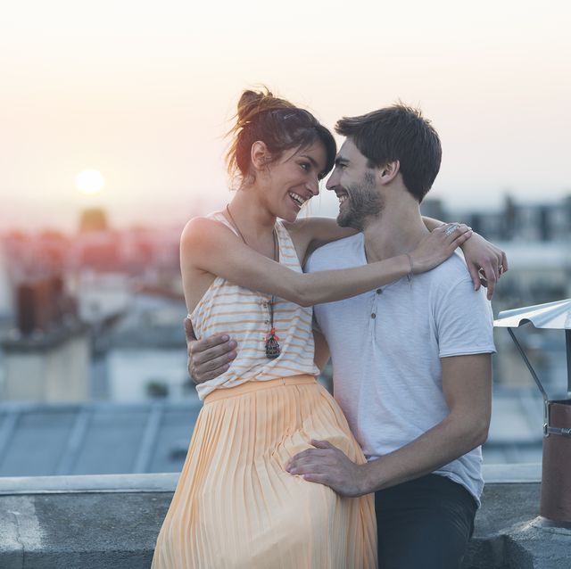 romantic couple on rooftop, paris