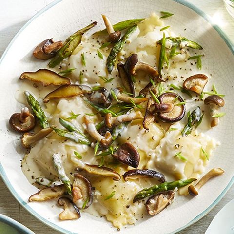 romantic dinner ravioli with creamy mushrooms and asparagus