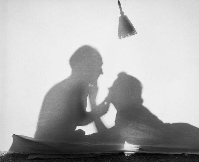 romantic couple silhouetted in a tent