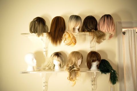 wall of wigs that roo powell uses during sting operations