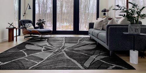 living room with black and white spiderman rug