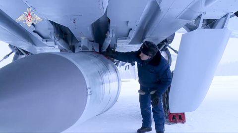 in this photo taken from video provided by the russian defense ministry press service on saturday, feb 19, 2022, a russian military technician checks a mig 31k fighter of the russian air force carrying a kinzhal hypersonic cruise missile parked at an air field during a military drills the russian military on friday announced massive drills of its strategic nuclear forces russian president vladimir putin will personally oversee saturdays exercise, which will involve multiple practice launches of intercontinental ballistic missiles and cruise missiles, the defense ministry said russian defense ministry press service via ap