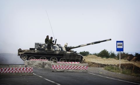 a russian t62 tank crosses the empty hig