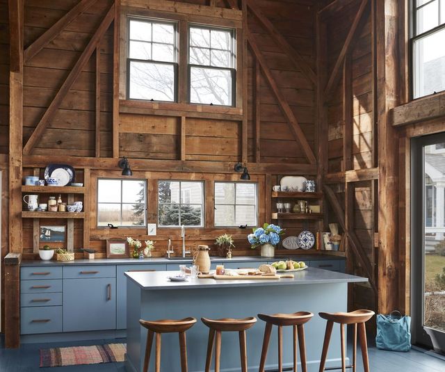 rustic kitchen with blue painted floor and blue cabinets