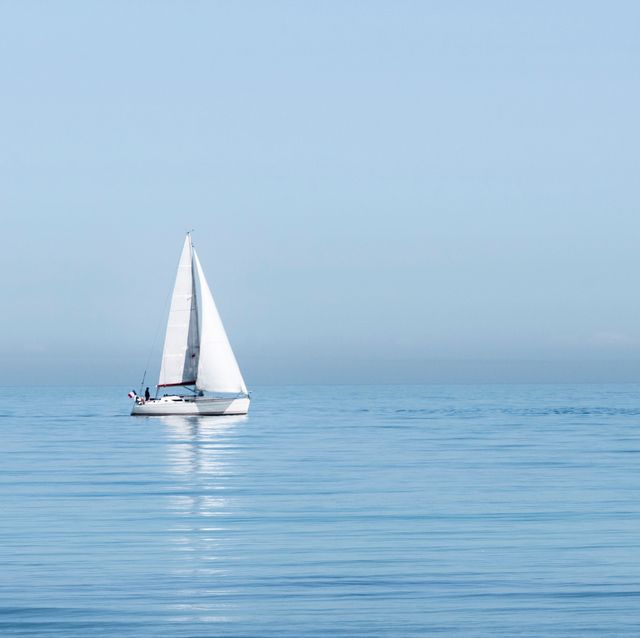 sailboat sailing on sea against clear sky
