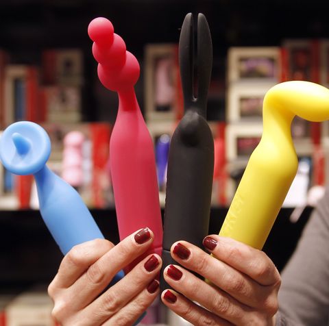 A saleswoman shows new women sex toys, n