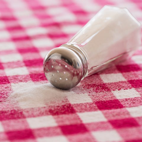 Salt shaker on checked tablecloth