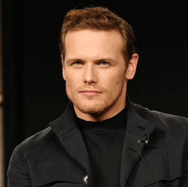 sam heughan from outlander looking sternly at the camera