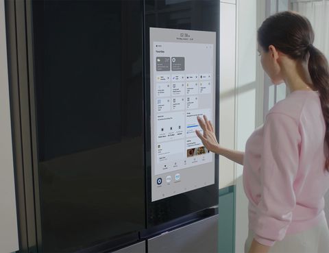 woman using a samsung bespoke ai fridge
