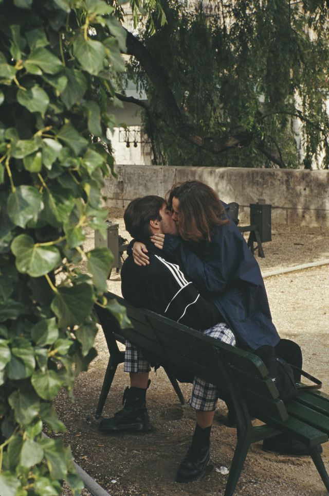 a couple kissing on a bench, paris, france, july 1996 photo by barbara alpergetty images