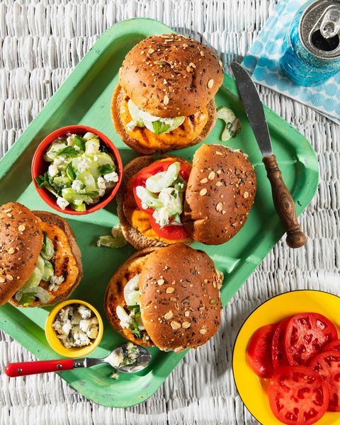 turkey burgers with blue cheese celery slaw on a green serving tray