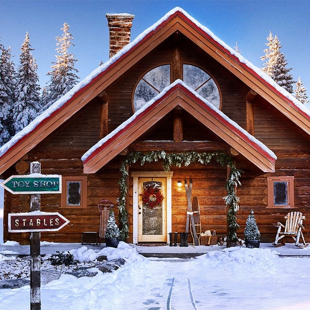 santa claus log cabin in snowy north pole setting with sign pointing to top shop and stables