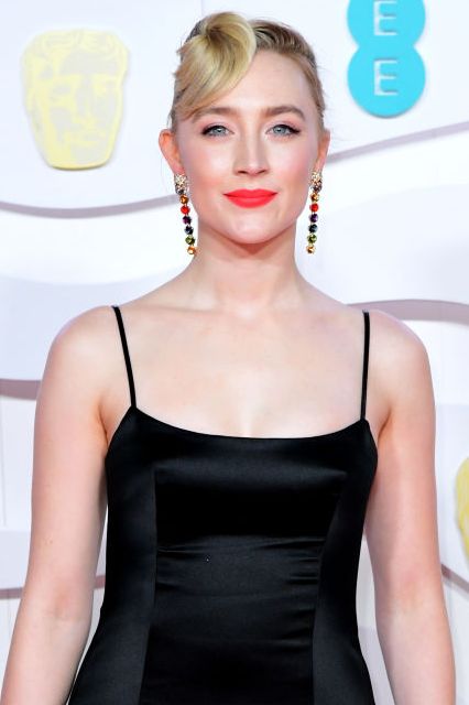 saoirse ronan wears a black gown on the red carpet
