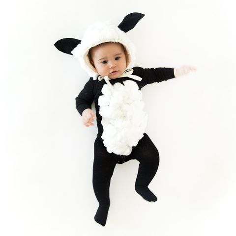 baby dressed as black sheep with furry bib and hoodie with sheep ears