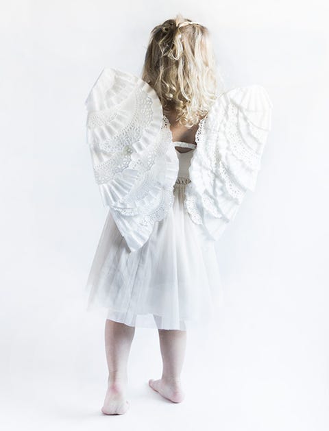 Back of a little girl wearing a white dress and angel wings back of a little girl wearing a white dress and angel wings