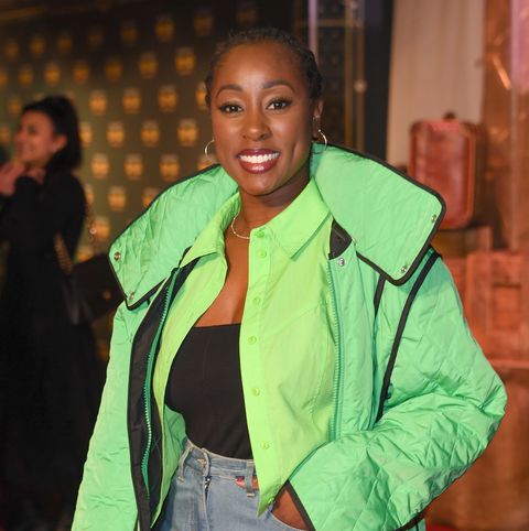 scarlette douglas in a big bright green jacket on a red carpet
