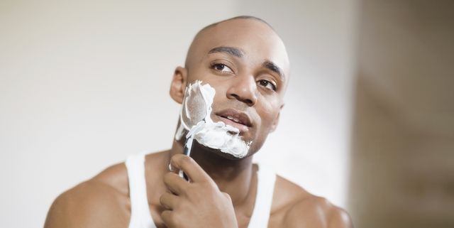 african man shaving face