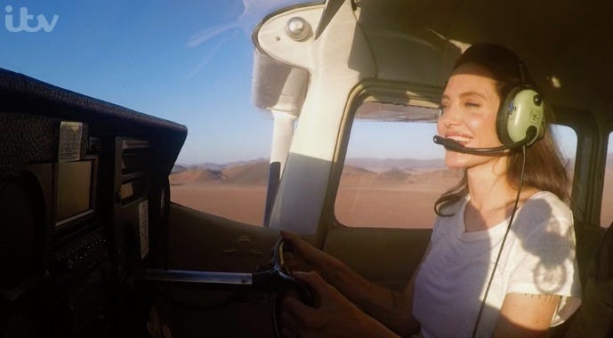 Angelina Jolie Wows Viewers By Nonchalantly Flying A Plane Over The