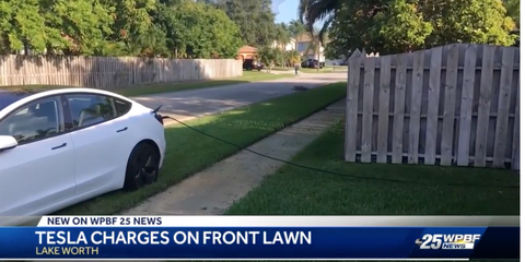 Tesla charging on front lawn