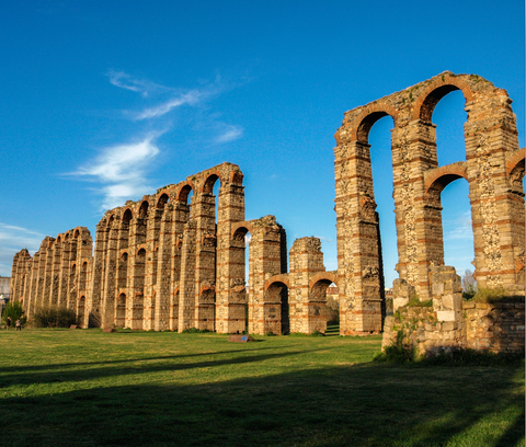 Ruins, Historic site, Aqueduct, Landmark, Ancient history, Sky, Architecture, Building, Ancient roman architecture, Grass,