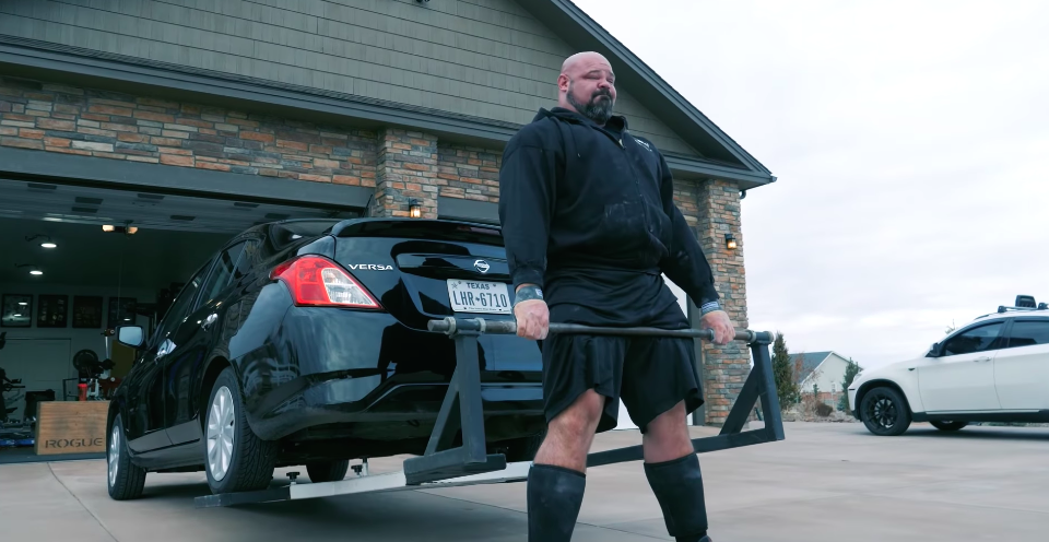 Strongman Brian Shaw Performs a Car 