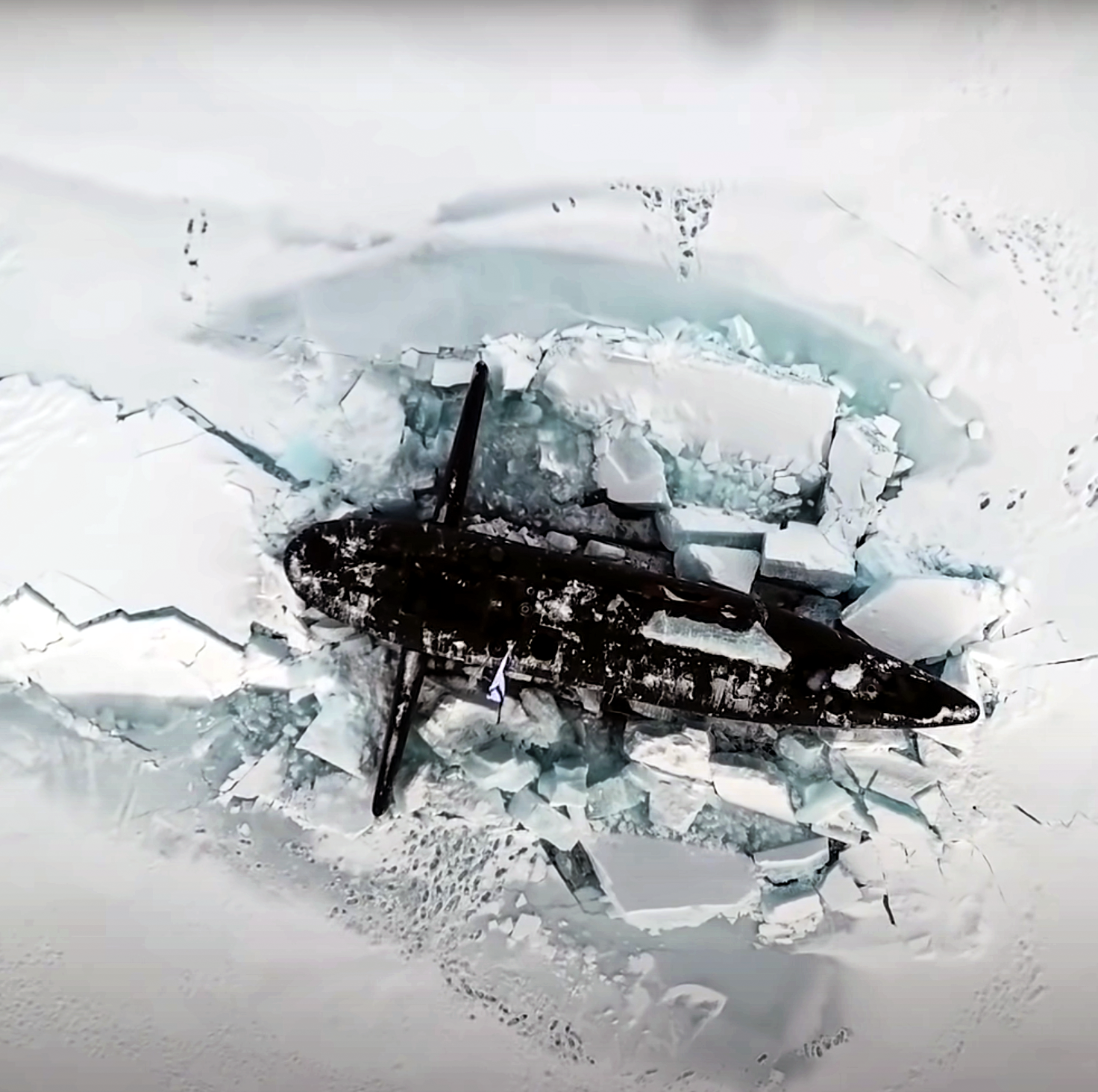Watch 3 Russian Nuclear Submarines Smash Through Arctic Ice at Once