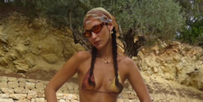 Bella Hadid Wears a Sunset-Printed Bikini and Belly Chain in Ibiza