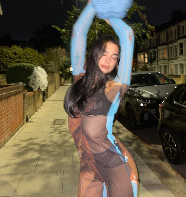Dua Lipa’s Sculpted Abs Shine In A Sheer Jumpsuit On Instagram