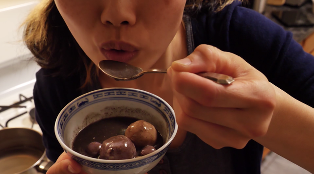 june eats a bowl of tang yuan and black sesame soup