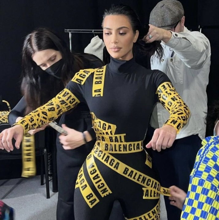 Kim Kardashian Shares BTS Footage Of How She Got Into Her Balenciaga Caution Tape Look