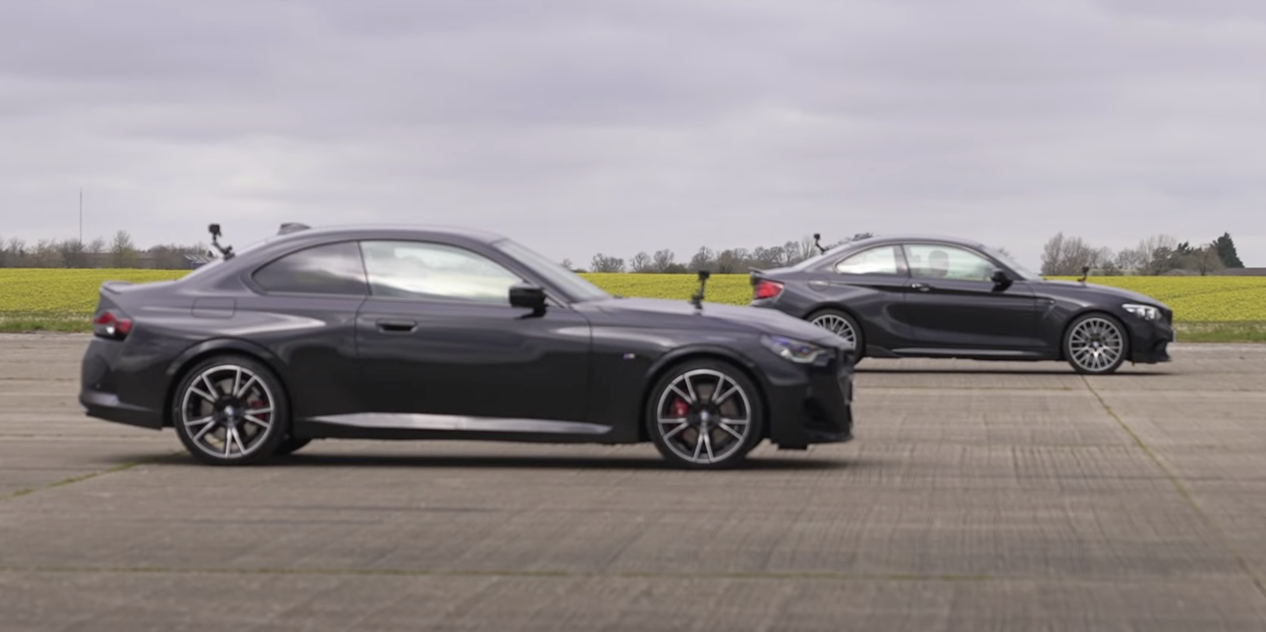 Watch the BMW M240i Smoke an M2 Competition in a Drag Race