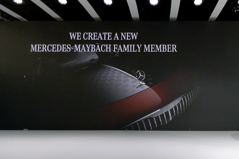 teaser photo of a new mercedes maybach vehicle at a presentation