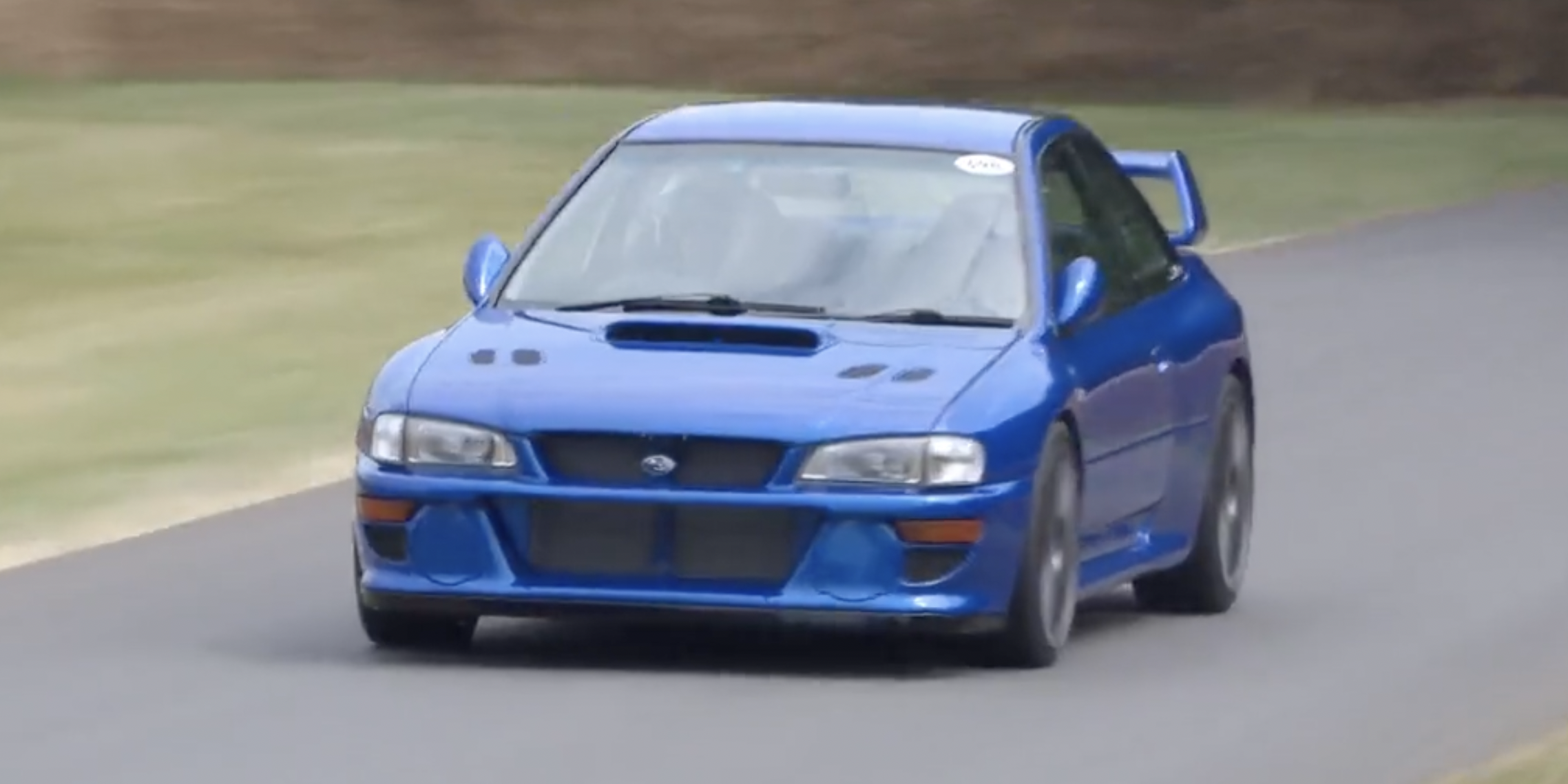 Watch Prodrive's P25 Impreza Restomod Fly Up the Hill at Goodwood