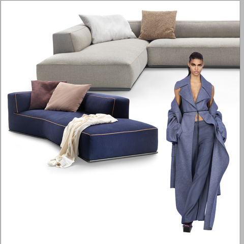 square modular sofas and ottomans in blues and beiges and the model in flowy blue pants and jacket off the shoulder