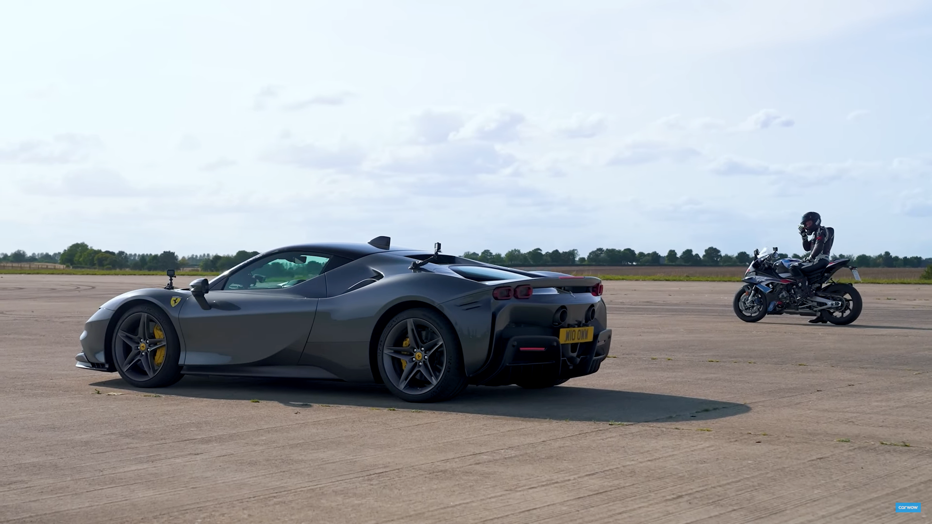 Watch a Ferrari SF90 Destroy a Superbike in a Drag Race