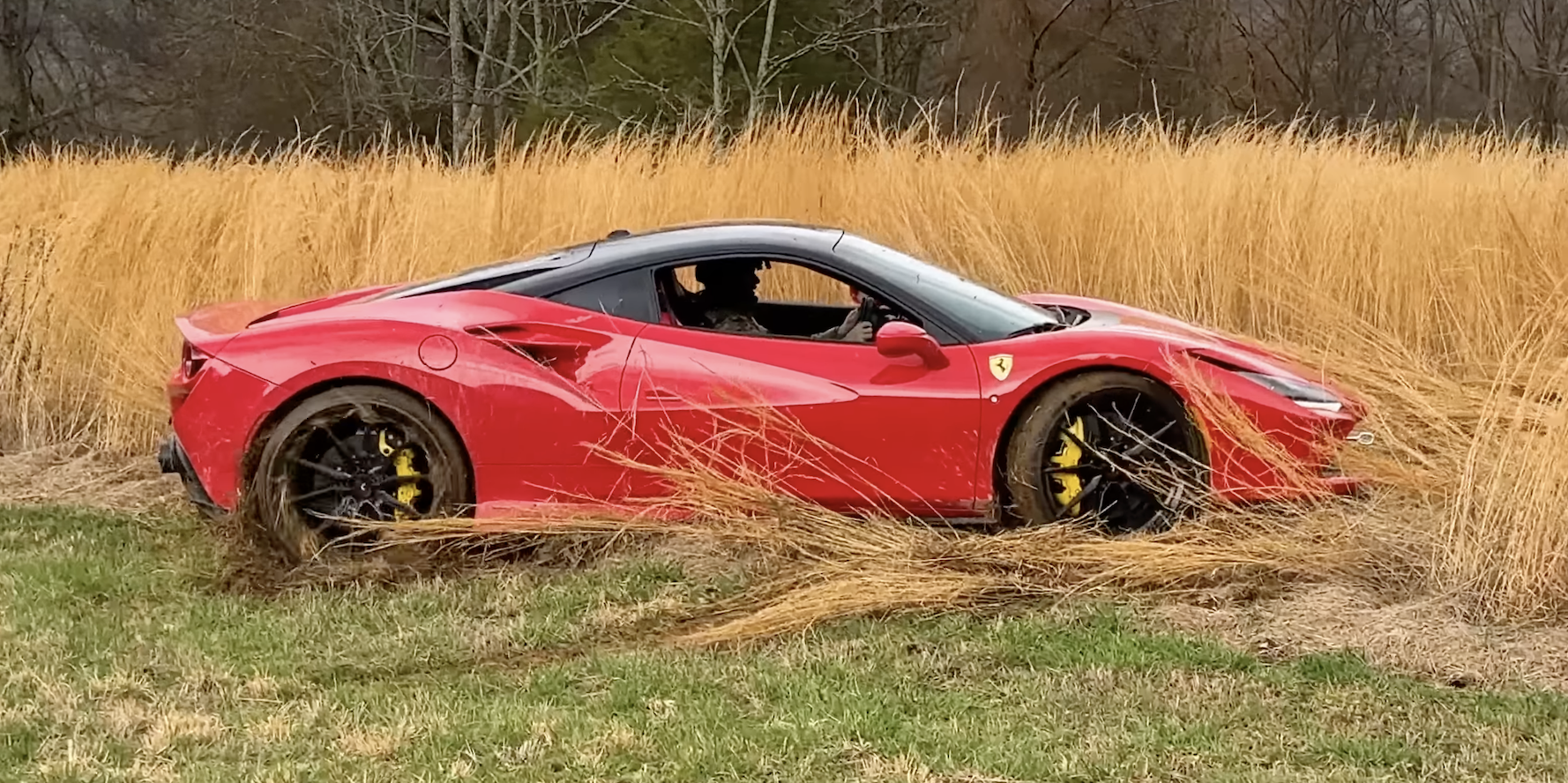 Watch a YouTuber Smash a Fence, Thrash on Gravel, and Climb Dirt Hills in Ferrari F8