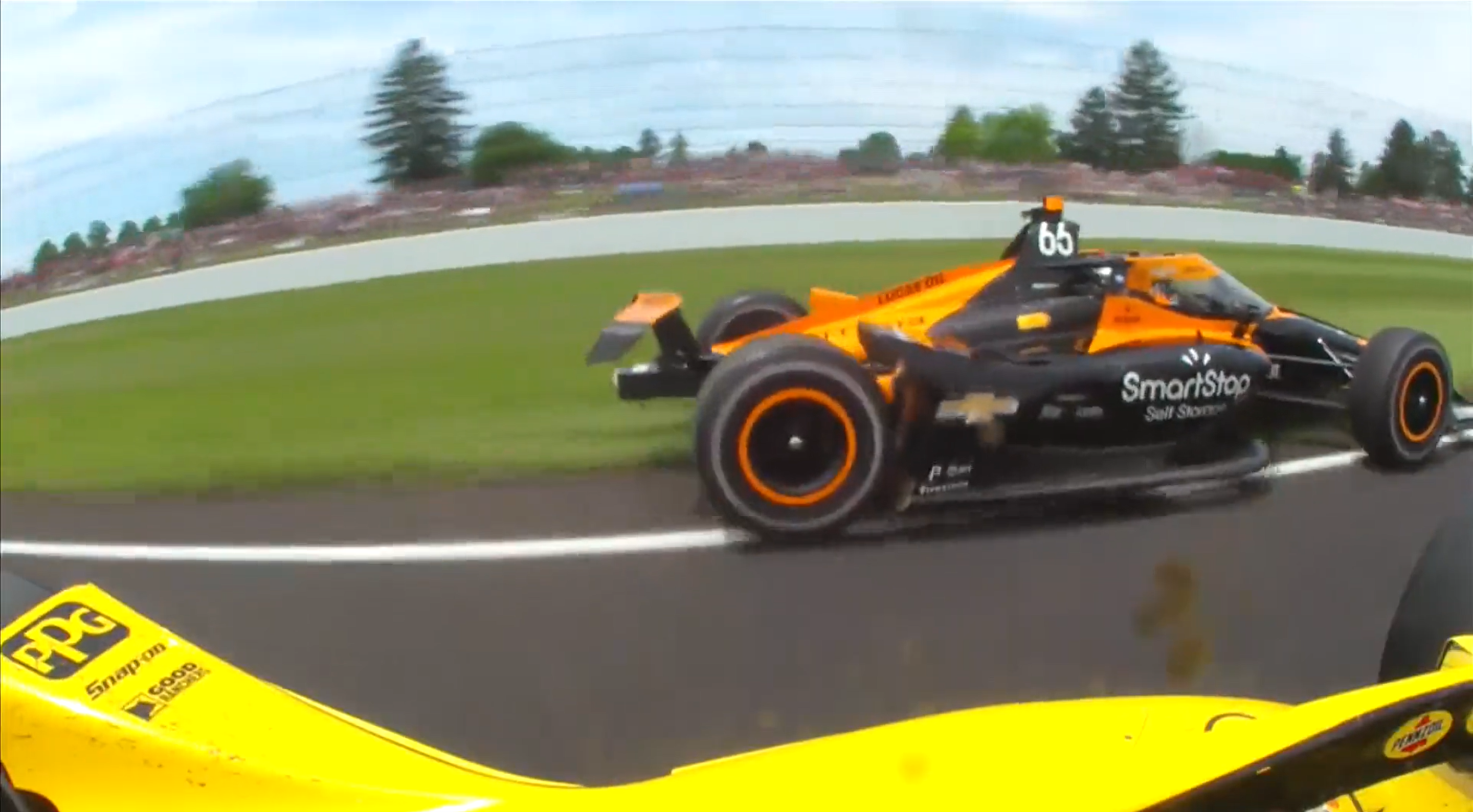 Watch Tony Kanaan Pass Three-Wide In Grass At 220 MPH