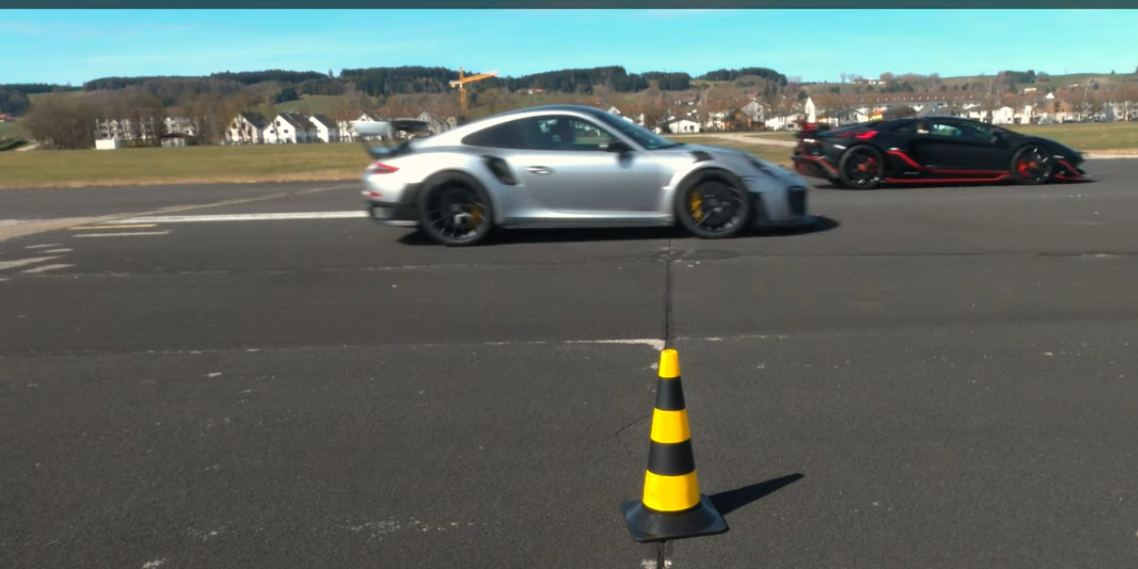 The Porsche 911 GT2 RS and the Lamborghini Aventador SVJ are close